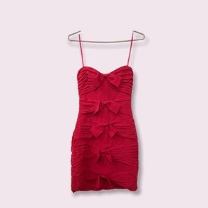 It’s a vibrant red dress. Size 04, from BCBGMAXAZRIA.